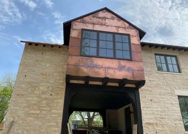 Copper metal panel facade on a stone building for Skylight Installation in Fellsmere